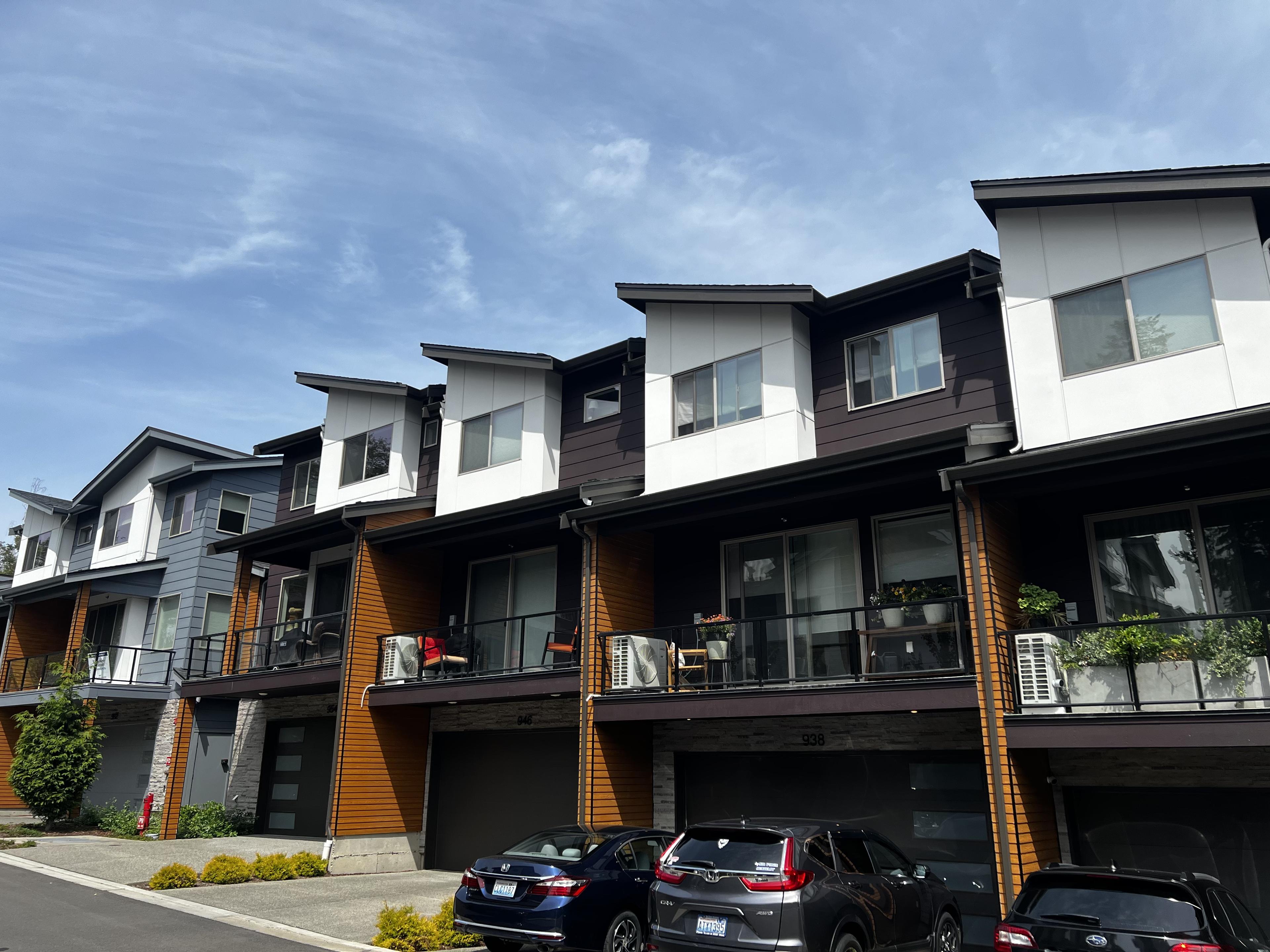 Best Exterior Cleaning crew performing commercial roof cleaning and moss treatment in Bellevue Washington