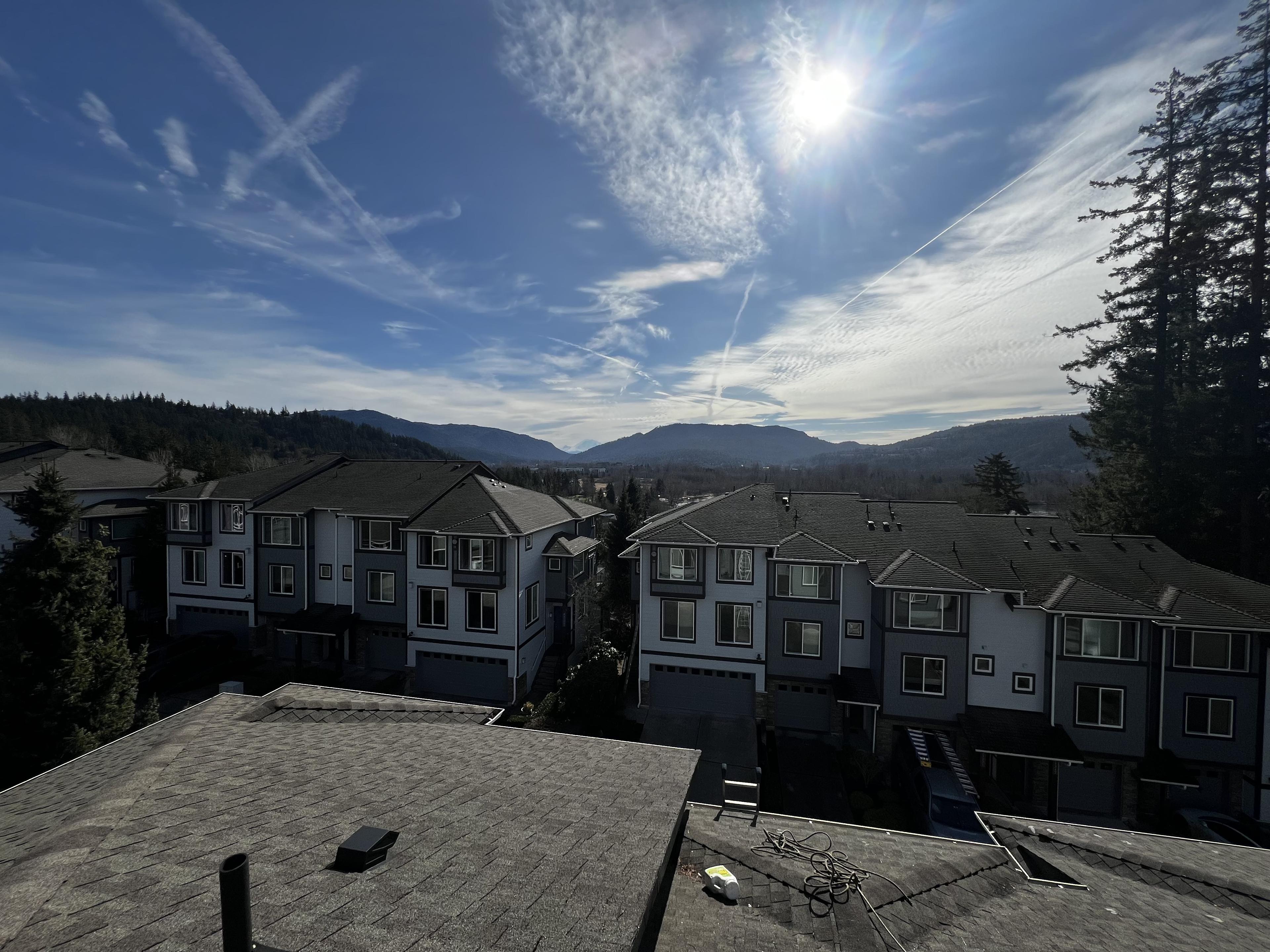 Low-pressure commercial roof cleaning process on a multi-story building in Bothell Washington