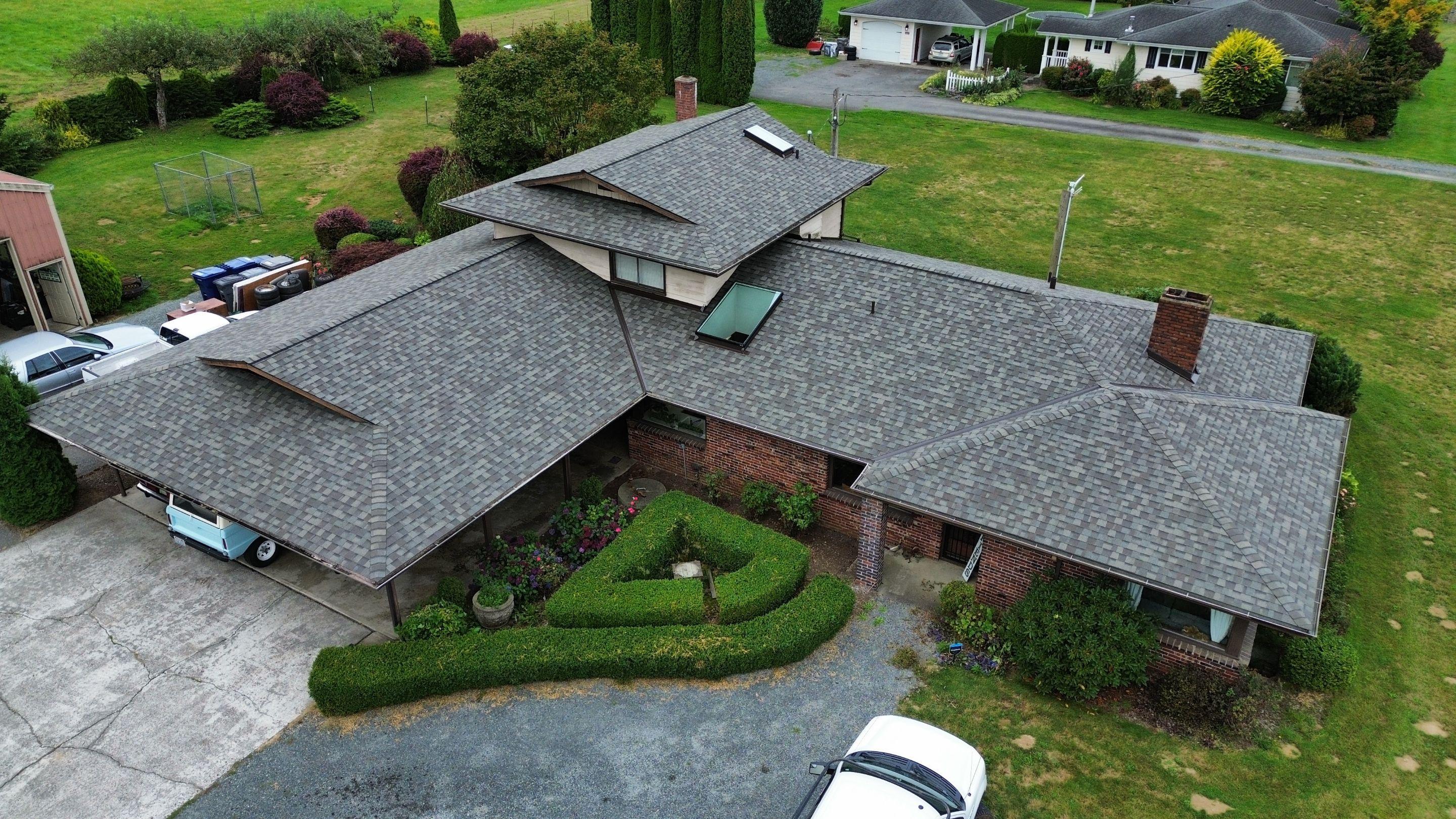 Safe roof cleaning process using air tools and brushing on composition shingles in Sammamish Washington